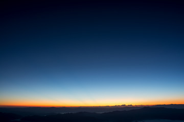 Fototapeta na wymiar Dramatic sunset and sunrise sky and mountain.