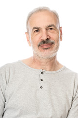 Obraz premium Close up portrait of a smiling attractive senior man looking dir