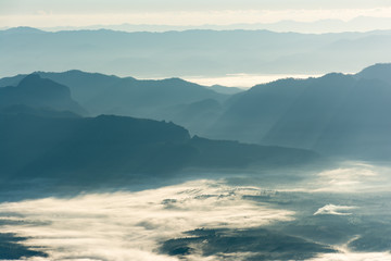 Mountain layer in morning winter fog.