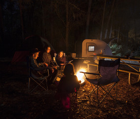 Family camping at night
