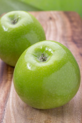 apples on a wooden board, top view, horizontal layout. fruit color image with space for writing