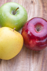 apples on a wooden board, top view, horizontal layout. fruit color image with space for writing