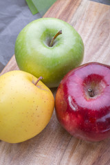 apples on a wooden board, top view, horizontal layout. fruit color image with space for writing