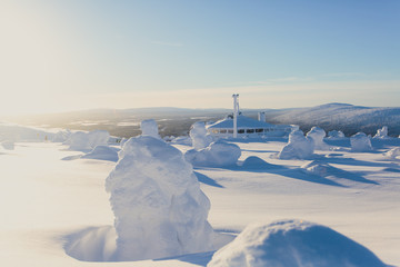 Beautiful cold mountain view of ski resort, sunny winter day with slope, piste and ski lift
