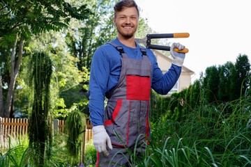 Young gardener with cutting clippers