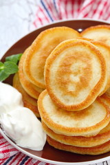 Obraz na płótnie Canvas Pancakes with sour cream