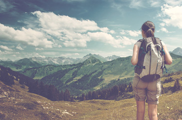 Female Hiker Admiring View of Mountain Valley