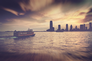 Water Taxi on Hudson River in front of NYC Skyline