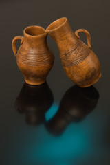 Beautiful decorative clay pots brown on a black background