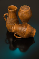 Beautiful decorative clay pots brown on a black background