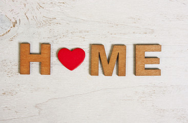 the word home made of wooden letters on a white background old w