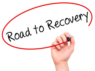 Man Hand writing Road to Recovery with black marker on visual sc