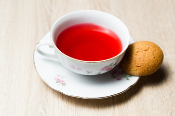 Cup of tea and cookies on wooden table