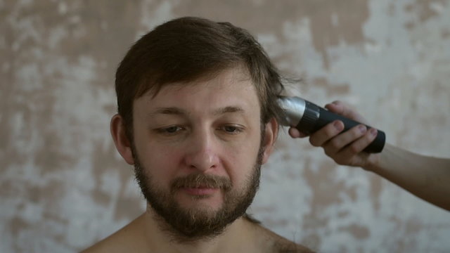 Cutting hair of a man