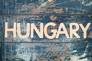 Hungary written with wooden letters on rustic surface
