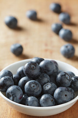 Blueberries in bowl on wooden. Blueberry contain antioxidant org