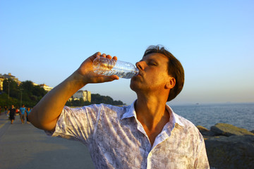 White man drinking water