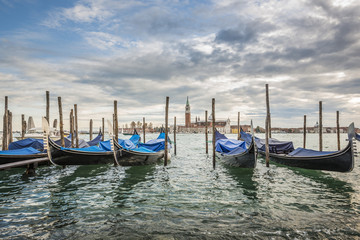 Fototapeta na wymiar Gondolas in lagoon of Venice and San Giorgio island in background, Italy, Europe 