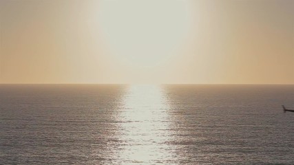 Helicopter Pass Thru Sun / Flying helicopter passing through sunset/sunrise.