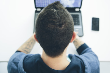 Young man working on a laptop