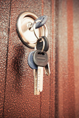 Metal door fragment with keys in keyhole