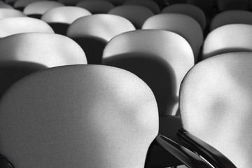Obraz premium Gray armchairs in a rows, empty auditorium interior
