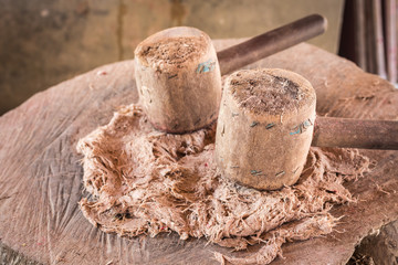 Two big wooden hammer and mulberry paper on wood log