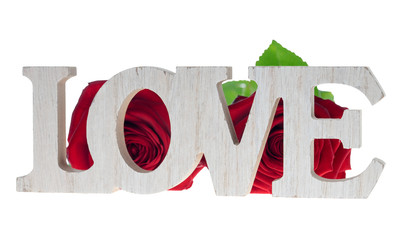 Love / Wooden letters with the word love and two roses isolated over a white background