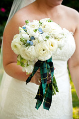 Irish Bride holding bouquet with tartan swatch