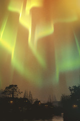 Fototapeta na wymiar aurora borealis, northern lights above village,illustration painting