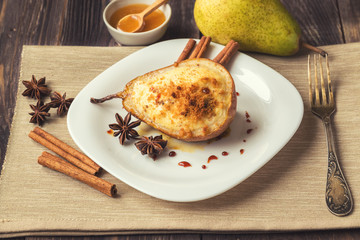 Baked pear with ricotta cheese, honey and cinnamon