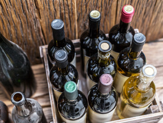 Wine bottles in a wooden crate .