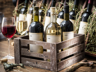 Wine bottles in a wooden crate . © volff