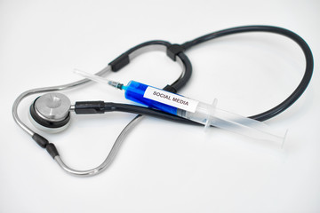Syringe with blue liquid. Social media addiction concept.