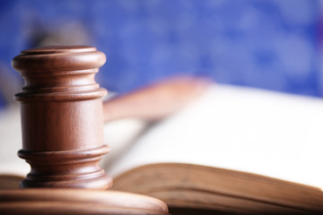 Law theme, mallet of judge, wooden gavel, books