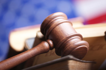 Law theme, mallet of judge, wooden gavel, books