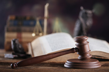Law theme, mallet of judge, wooden gavel, books