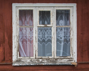 Fototapeta premium closed old window on a aged wooden wall
