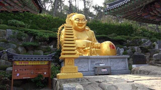 Statue of Budai at the Haedong Yonggung Temple. Busan, South Korea