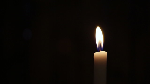 closeup of candle on black