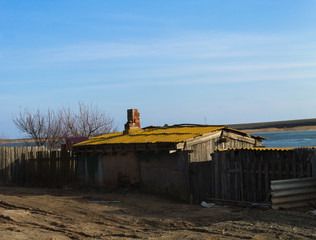 Old house on the street near the lake.