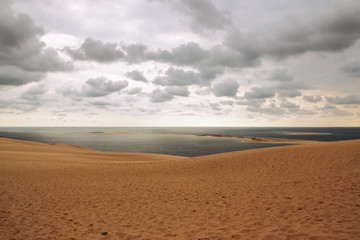 Fototapeta na wymiar Dune of Pilat, view over the ocean and cloudy sky