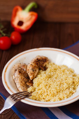 Homemade couscous with fillet grilled with herbs