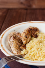 Homemade couscous with fillet grilled with herbs