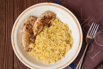 Homemade couscous with fillet grilled with herbs