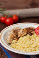 Homemade couscous with fillet grilled with herbs