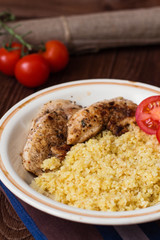 Homemade couscous with fillet grilled with herbs