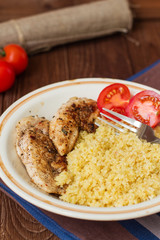 Homemade couscous with fillet grilled with herbs