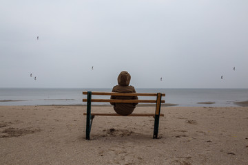 Loneliness teenager sitting on a bench