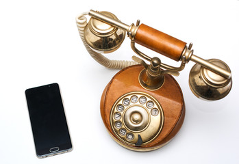 Old vintage phone and new modern smartphone